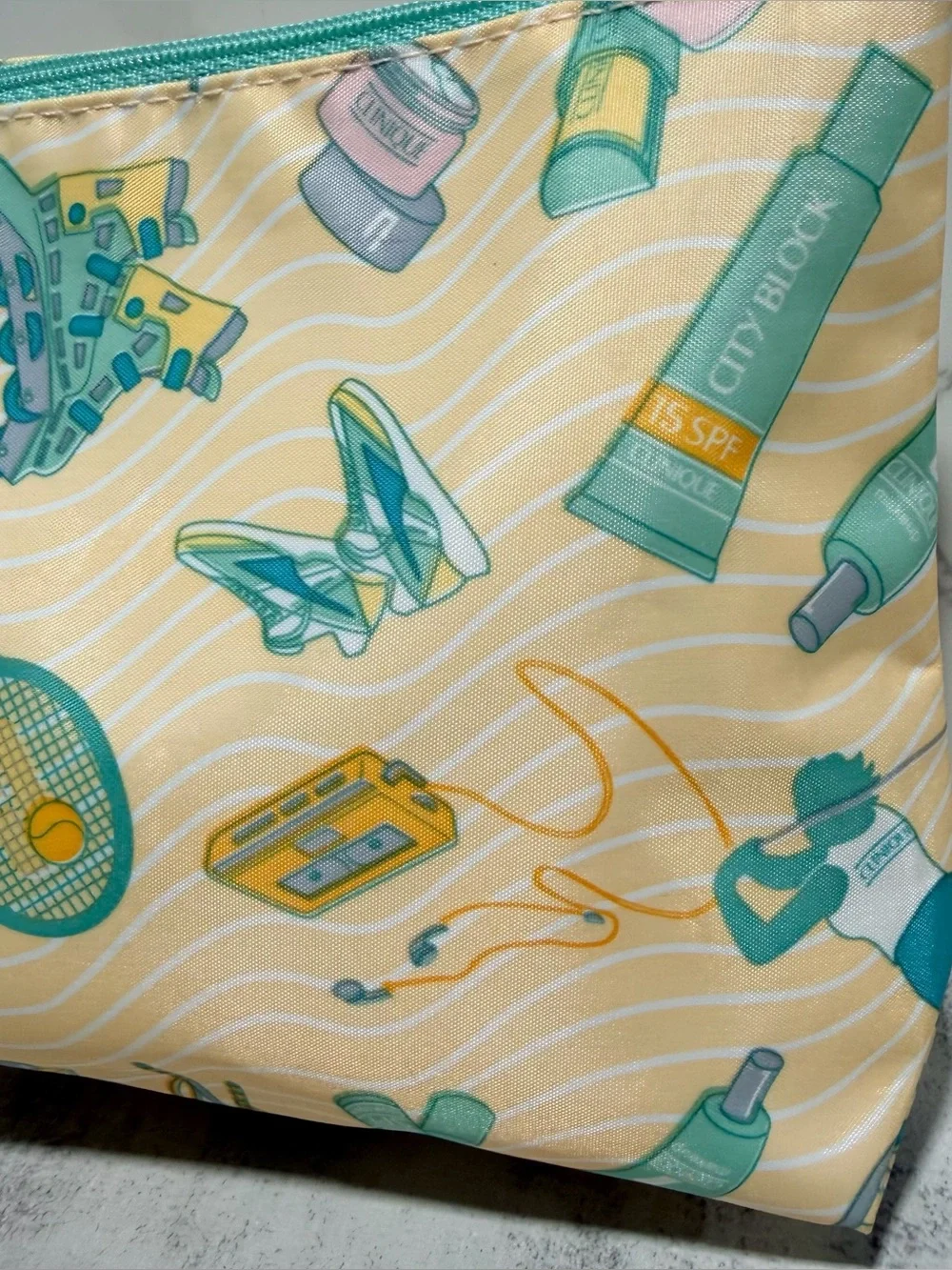 CLINIQUE Yellow & Teal Tennis Graphic Cosmetic Pouch